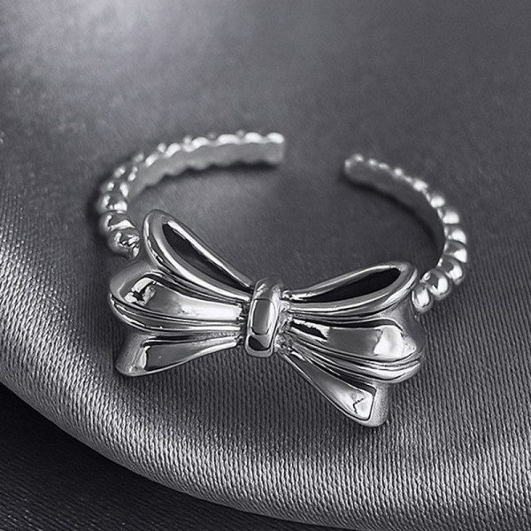 Разомкнутое кольцо с объемным бантом в стиле ретро 1J12185CJJ