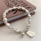 Браслет из крупных металлических бусин с подвеской CJG69039