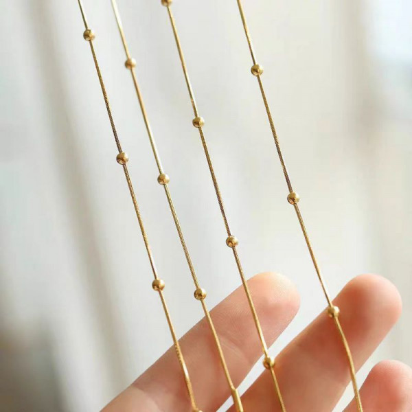 Золотистая стальная цепочка с декоративными шариками CJH55100