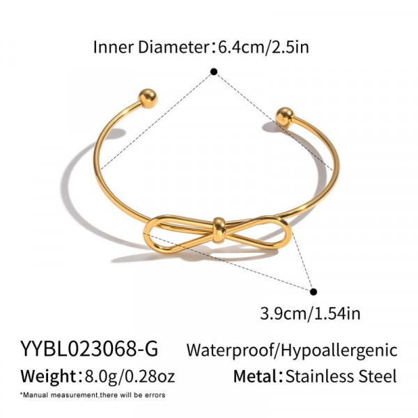 Золотистый браслет-кафф с центральным элементом в виде банта 1J12459CJJ