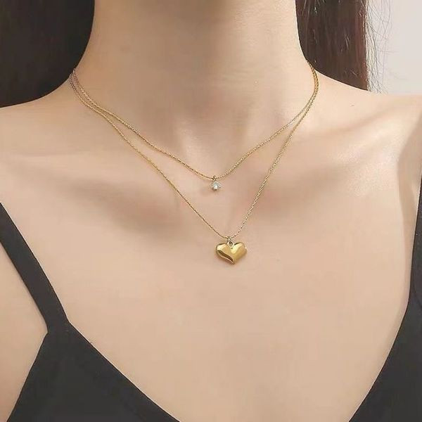 Золотистое многослойное колье с сердцем CJL91311