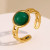 Кольцо с круглым зеленым камнем и ажурной шинкой CJL49937