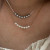 Тонкое колье с дорожкой из переливающихся кристаллов J10795CJJ