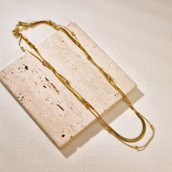 Золотистое двухслойное колье из тонких цепей с жемчужиной CJP75744