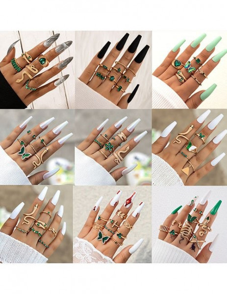 Золотистый сет тонких колец с зелеными камнями Z15741