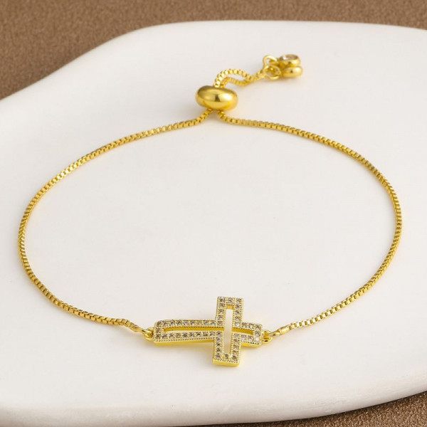 Тонкий золотистый браслет с декоративным крестом CJL32157