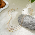 Тонкая золотистая цепочка с подвесками в форме миниатюрных колец CJL16494