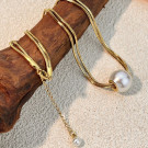 Золотистое колье-галстук с крупным жемчугом CJP52634