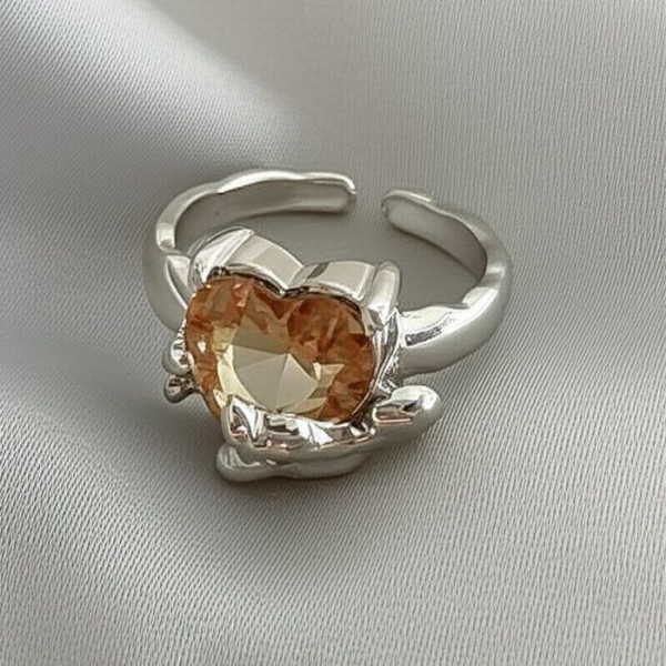 Незамкнутое кольцо с персиковым кристаллом в форме сердца U99257MSK