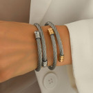 Браслет-жгут из стальных нитей с золотистыми наконечниками CJT17388