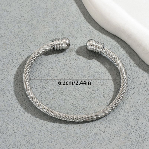 Браслет-жгут из стальных нитей с золотистыми наконечниками CJT17388