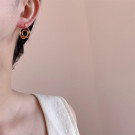 Изящные серьги-конго из золотистого металла с плетеным узором CJP40983