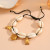 Браслет в морском стиле из ракушек с подвесками CJM52750