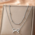 Золотистое многослойное колье с бантиком CJL77006