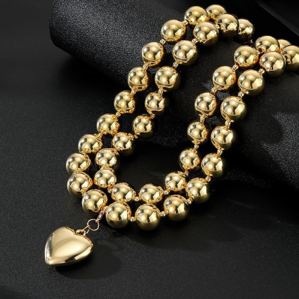 Многослойное колье из золотистых шариков с крупной подвеской-сердцем CJN37603
