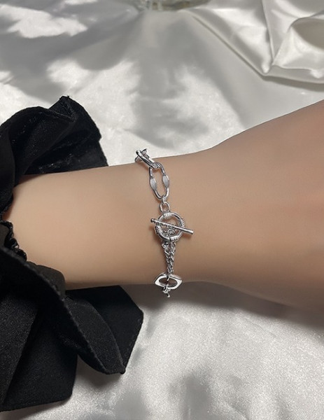 Браслет с плетеным узором и фианитами R86999