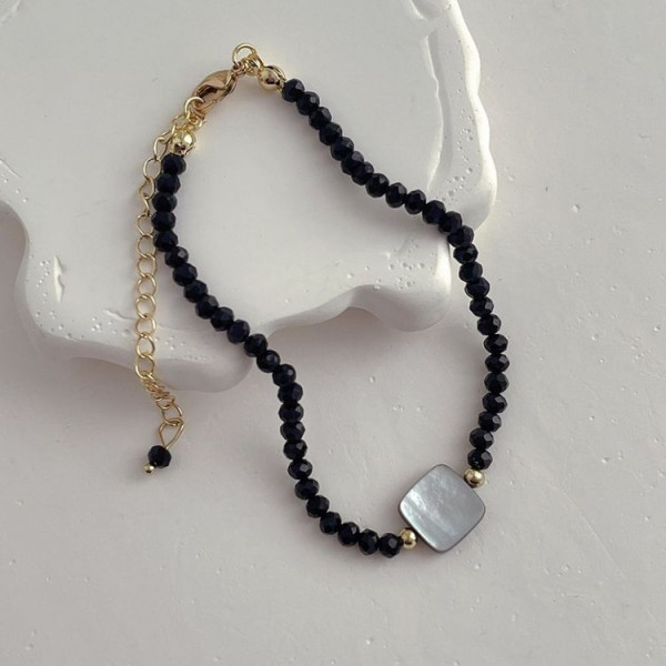 Длинные черные бусы с центральным серебристым диском J11257CJJ