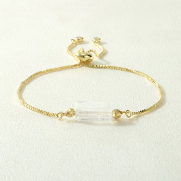 Браслет на золотистой цепочке с цилиндрическим камнем CJM78625