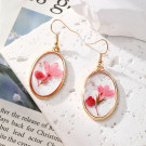 Золотистые серьги крючки с сухоцветами в овальной оправе CJ27162