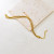 Браслет многослойный из тонких золотистых нитей CJR56264