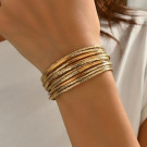 Браслет жесткий многоярусный из тонких золотистых колец CJP93797