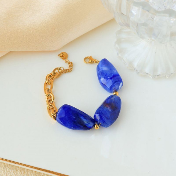 Браслет золотистый с крупными вставками под янтарь CJP93460