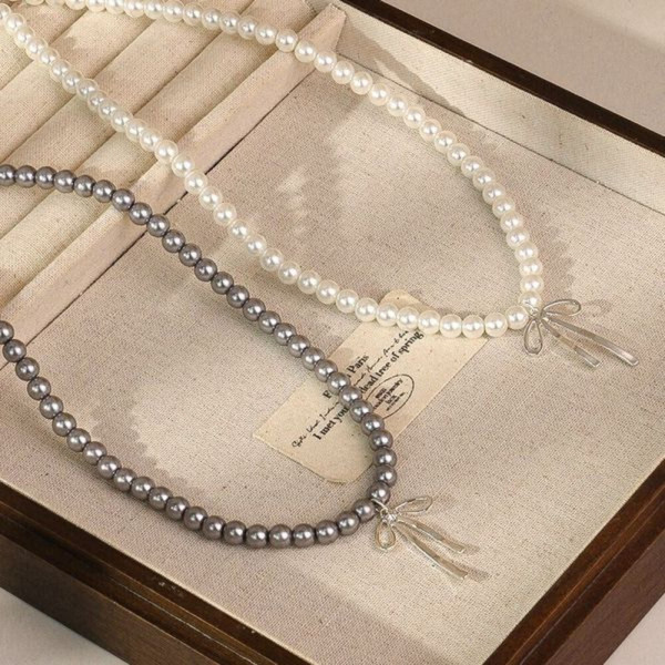 Изысканные бусы из жемчуга с декоративным бантом CJH38343