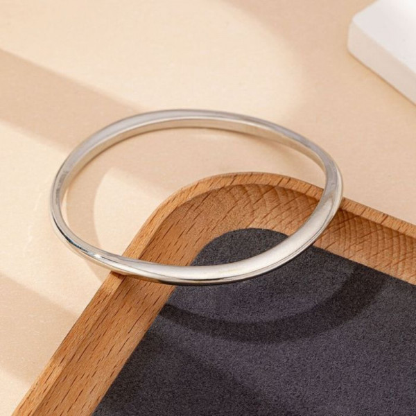 Браслет жесткий разомкнутый с волнообразным изгибом CJH99045