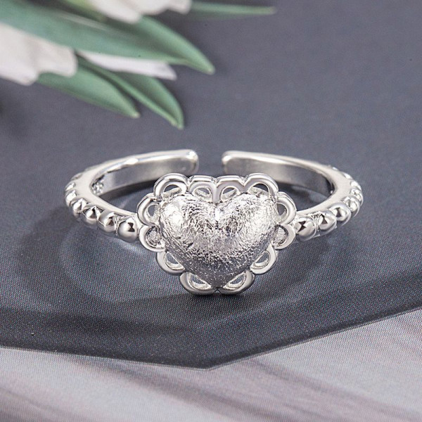 Кольцо с фактурным сердцем и жемчужным отливом 1J11924CJJ