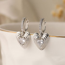 Серебристые серьги-кольца с рельефными сердцами N96328