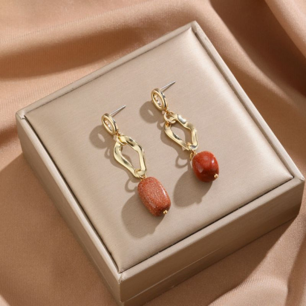 Серьги-подвески из фактурного металла с терракотовыми вставками CJP93775