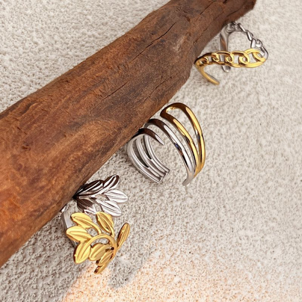 Разомкнутое стальное кольцо в форме ажурного листа CJN76670