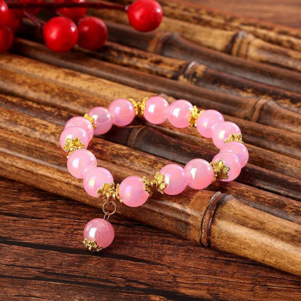 Браслет из розовых бусин с золотистыми разделителями CJH59294