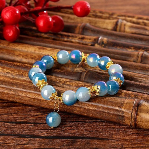 Браслет из розовых бусин с золотистыми разделителями CJH59294