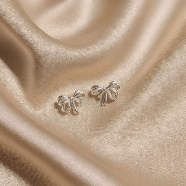 Серьги-гвоздики бантики медь напыление платиной 1J12405CJJ